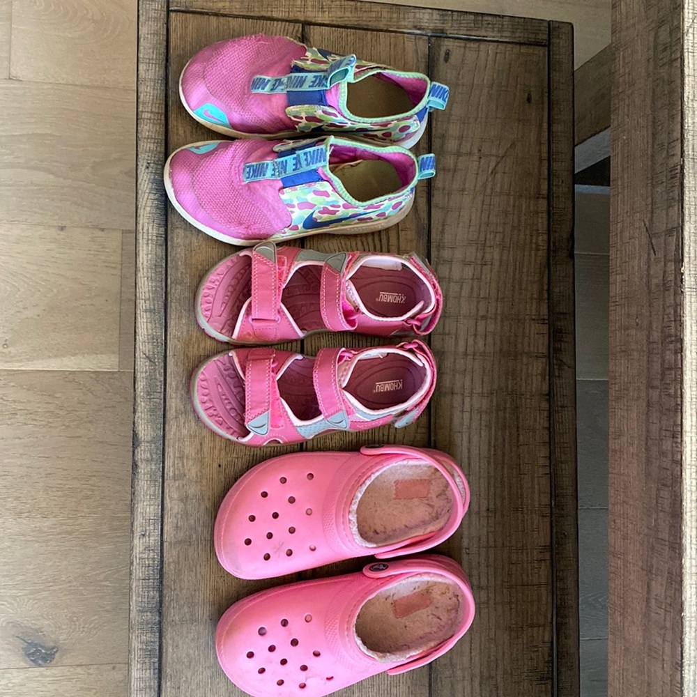 Three pairs of girls pink shoes size 1 Nike, Khombu, crocs